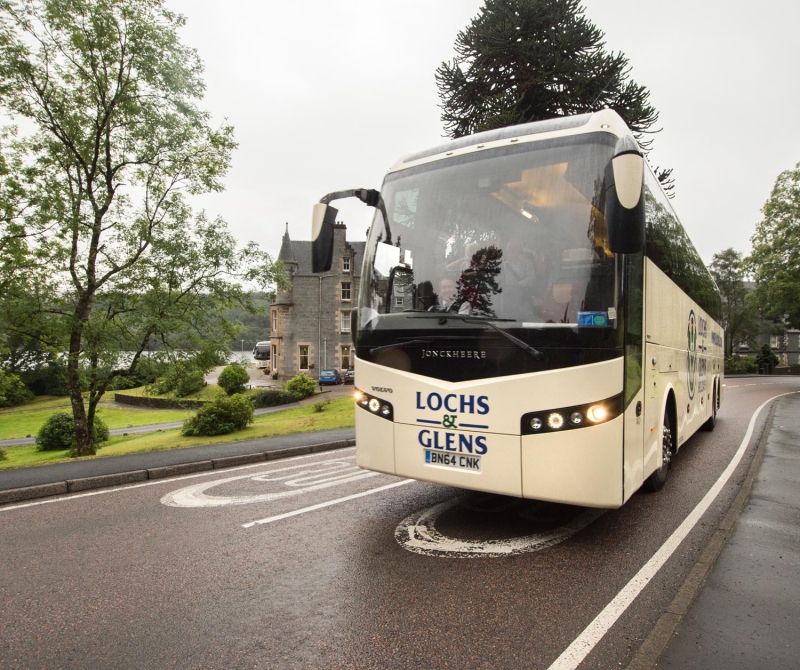 Lochs &amp; Glens Coaches touring visitors around Scotlands Highland